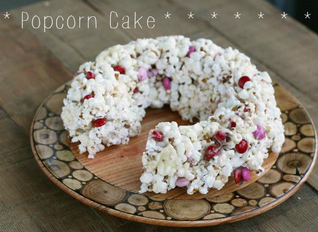 Popcorn cake recipe. Use any color/kind of candy to customize. Repin to save!