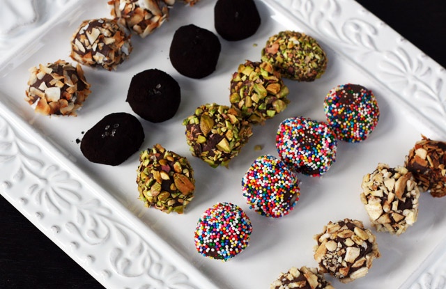Chocolate ganache truffles, rolled in toasted coconut, black cocoa and sea salt, pistachios, candy sprinkles, and toasted almonds.