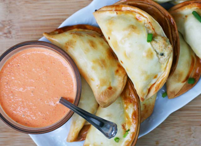 Turkey empanadas, made out of leftover turkey. Served with a red pepper sauce. Repin to save!