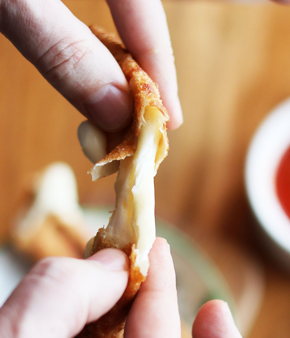Homemade mozzarella sticks made with egg roll or wonton wrappers: Click through for recipe.