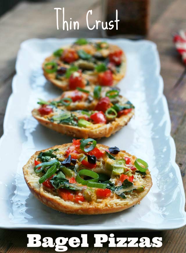 Thin crust bagel pizzas. These little pizzas are easier to eat because there's less bagel and more yummy toppings. Click through for recipe.