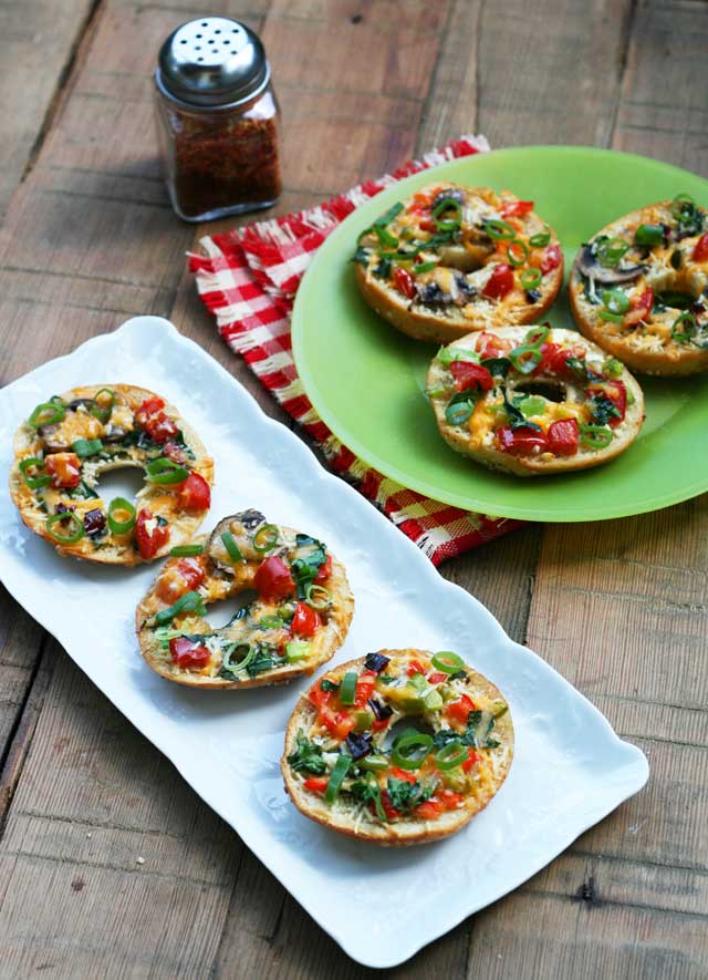 Thin crust bagel pizzas. The bagels are cut in thirds, making for a thinner, crispier crust. Repin to save!