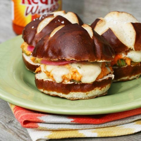 Buffalo chicken melt sliders (on a pretzel bun!) Click through for recipe.