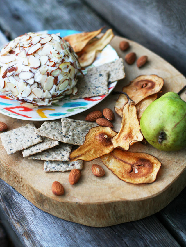 Make a tropical cheese ball (with pineapple, vanilla, and nuts) and serve with homemade pear chips. Click through for recipe.