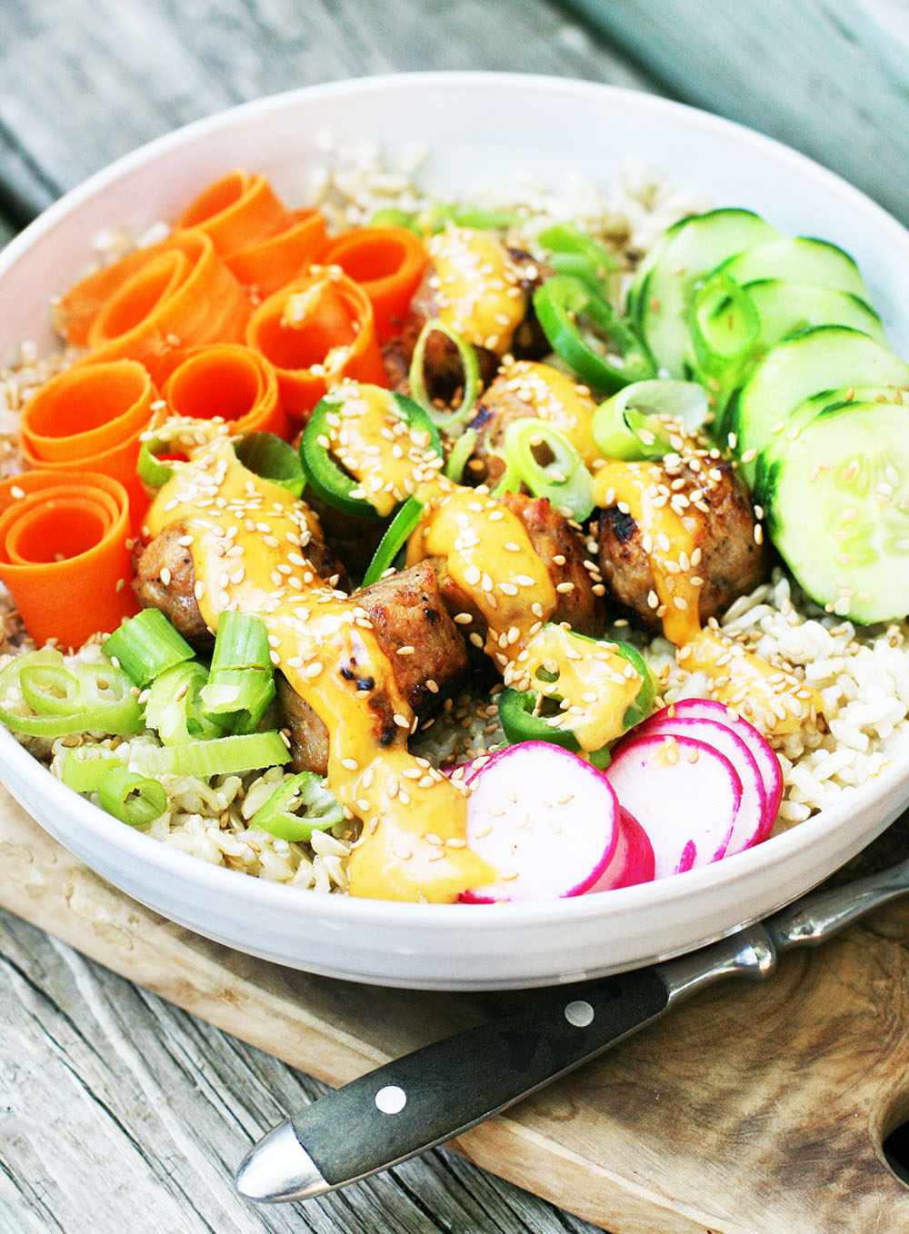 Chicken banh mi meatballs can be served in a variety of ways, including in a flavorful rice bowl.