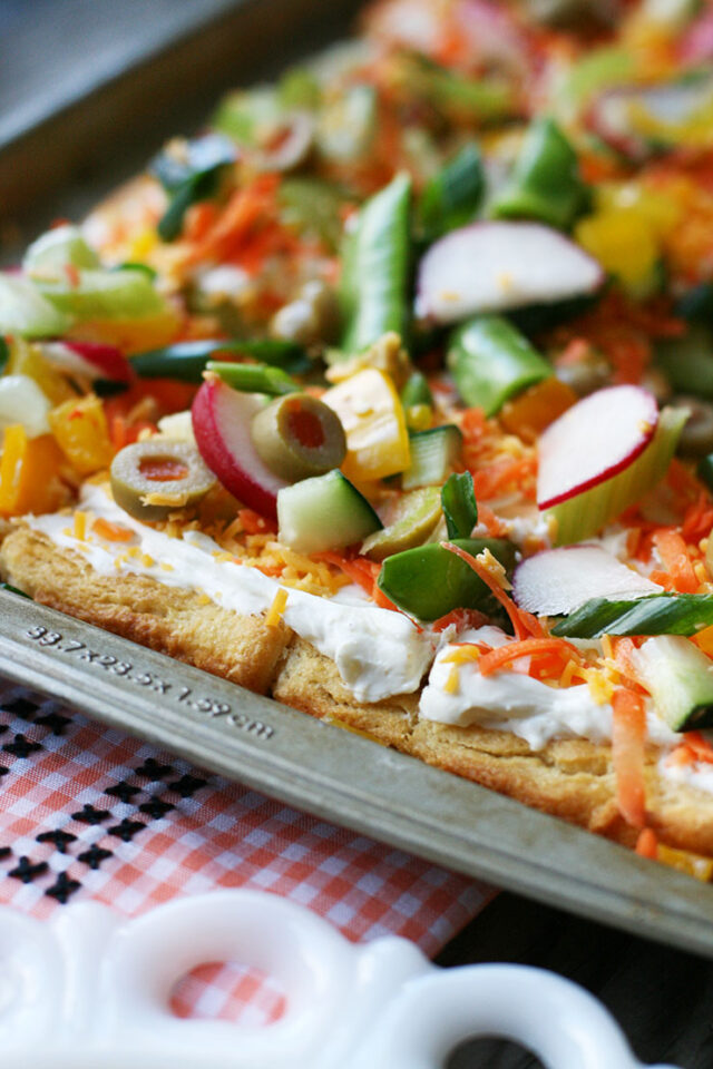 Cold veggie pizza: Crescent roll crust, herb cream cheese, and plenty of fresh veggies!