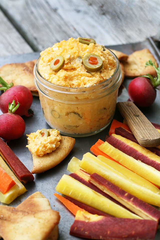 Pimento and green olive cheese spread. Delicious with pita chips and veggies. Click through for recipe!