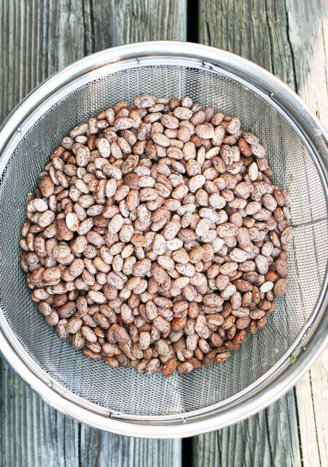 How to make pinto beans in the slow cooker: Delicious beans at 1/3 the cost! Click through for instructions.