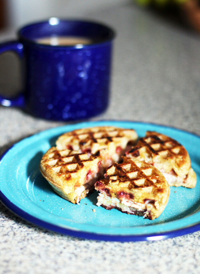 Make a sandwich out of frozen waffles! This one is made with turkey, cream cheese, and raspberry jam. Click through for more frozen waffle hacks.
