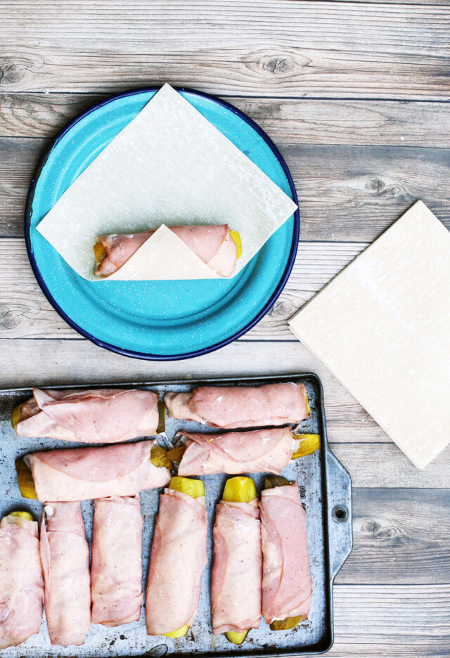 How to make ham and pickle roll up egg rolls. Click through for recipe!
