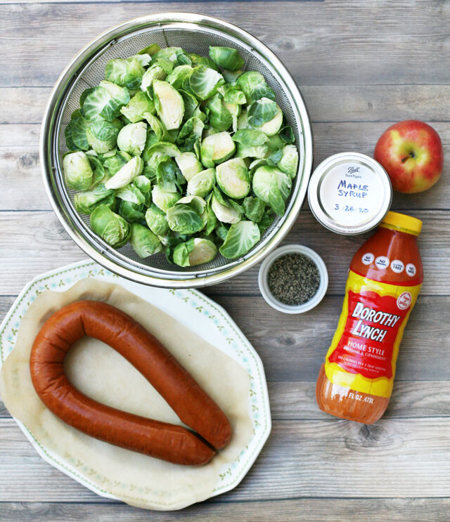 Ingredients to make maple-roasted Brussels sprouts and ring bologna.