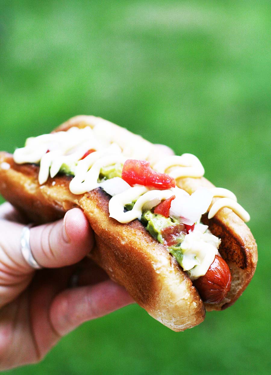 Completos - Chilean-style hot dogs - are loaded with toppings. Click through for recipe.