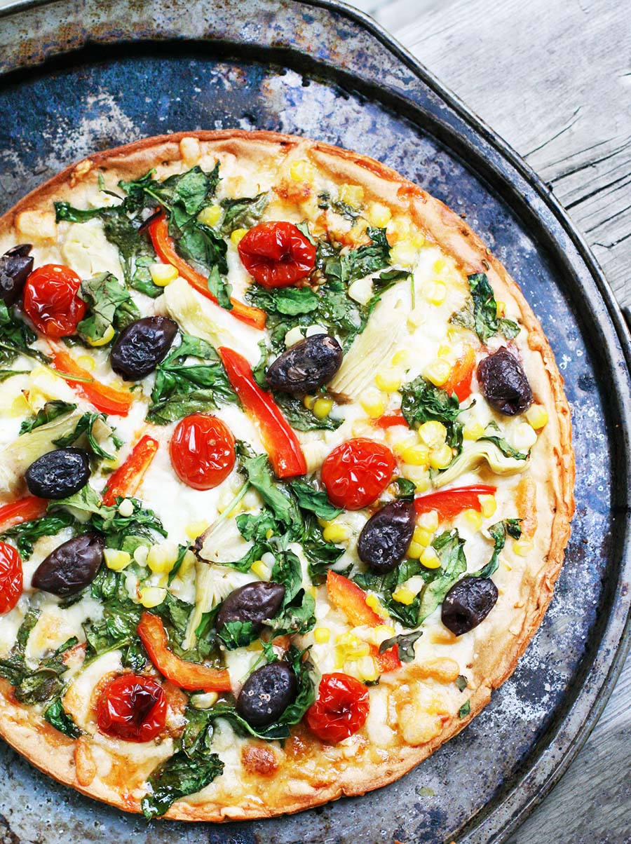 Fully loaded veggie pizza: Clean out your fridge and freezer and make a fully loaded vegetable pizza!