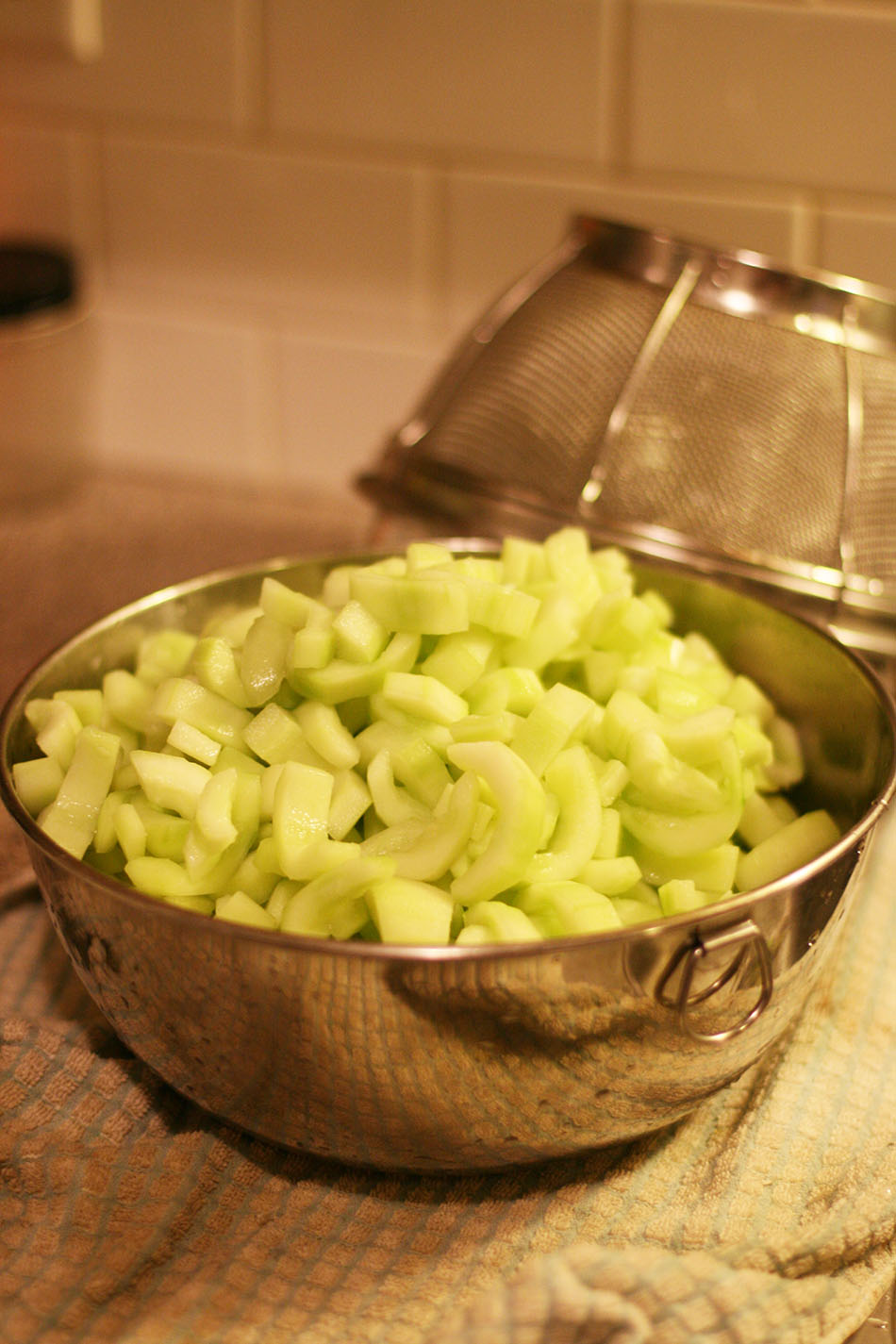 Cucumbers after soaking in pickling lime solution. Click through to learn how to make homemade Christmas pickles.